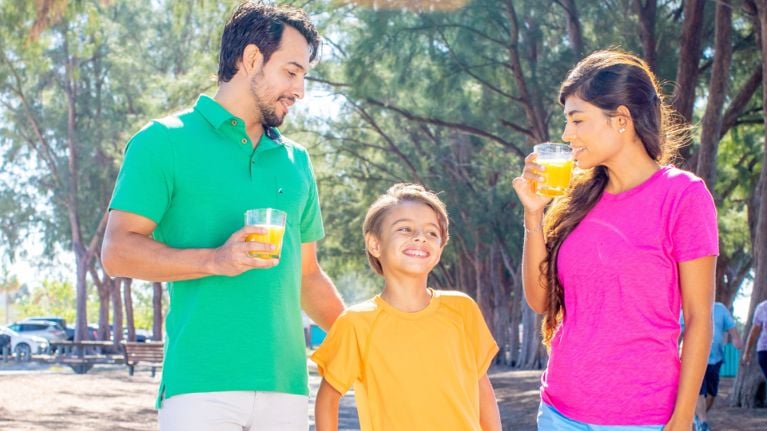 A family drinking orange juice