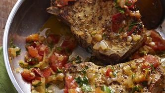 Smothered pork chops with citrus parsley