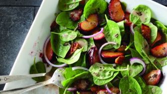 Roasted plum and spinach salad