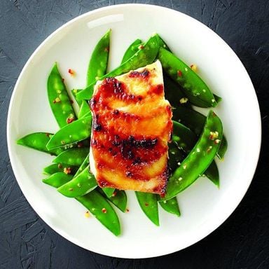 Golden glazed halibut with snow peas