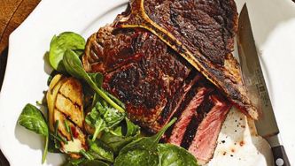 Porcini-rubbed T-bone with fingerling and spinach salad