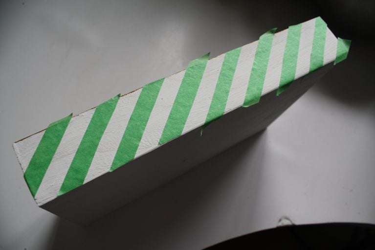 painting and taping striped white and gold wooden vanity tray
