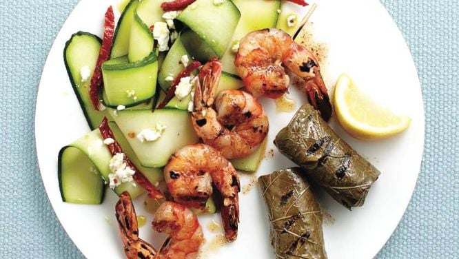 Grilled spiced shrimp and dolmades with zucchini salad