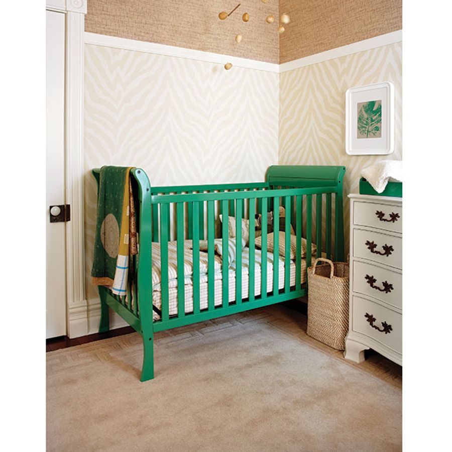 green crib and dresser Six tips to create a modern nursery on a budget