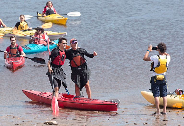 Prime Minister Justin Trudeau, left, gets his picture taken before going on a kayak ride on the Saguenay River, Friday, August 26, 2016 in Saguenay Que. THE CANADIAN PRESS/Jacques Boissinot