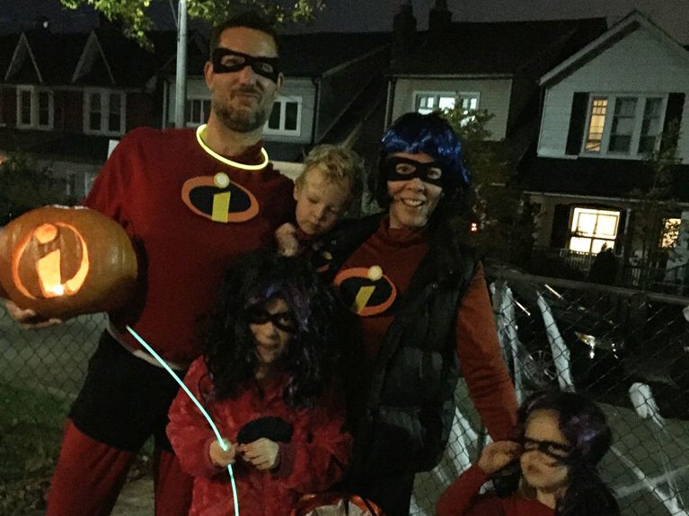 Janine Cole, her husband and their three kids dressed up as superheroes fro halloween. husband came out as gay