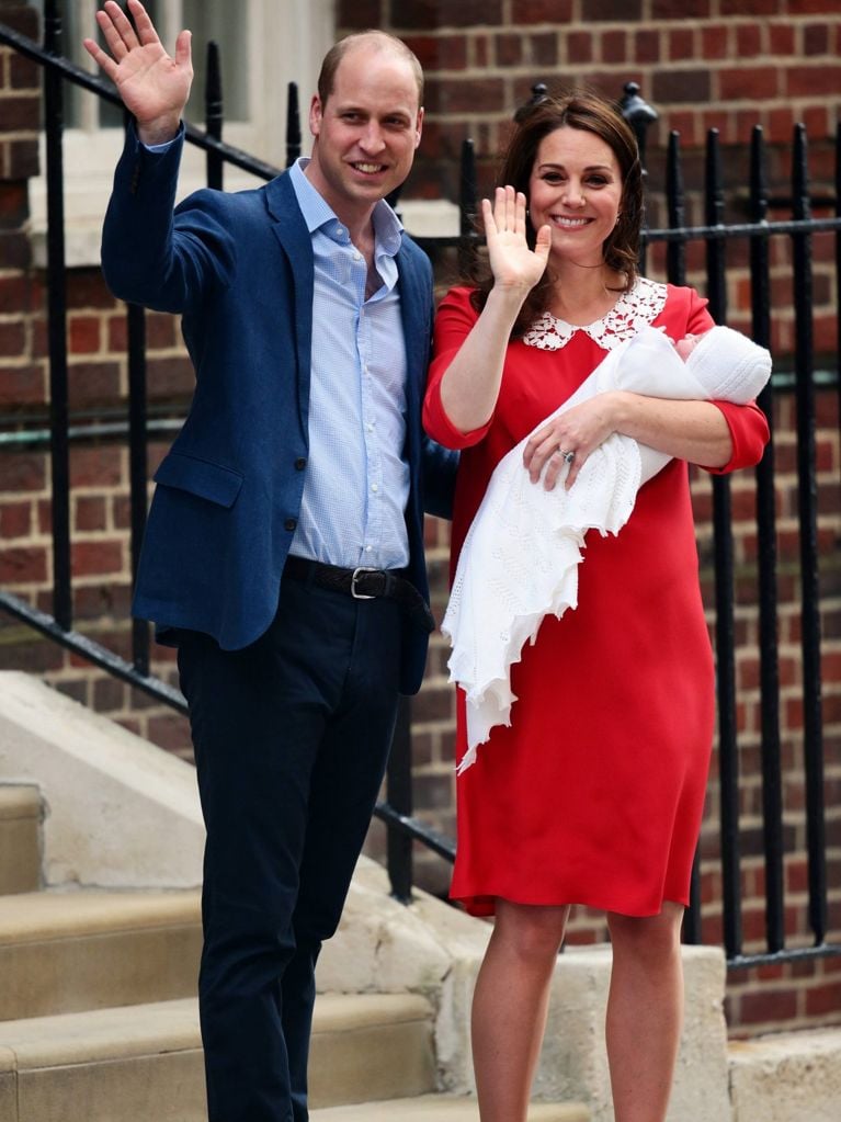 Prince William and Kate Middleton leave the hospital with their 3rd baby. She beamed in a custom red Jenny Packham dress.