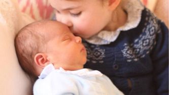 Prince Louis Gets A Kiss From Princess Charlotte In His First Official Photos