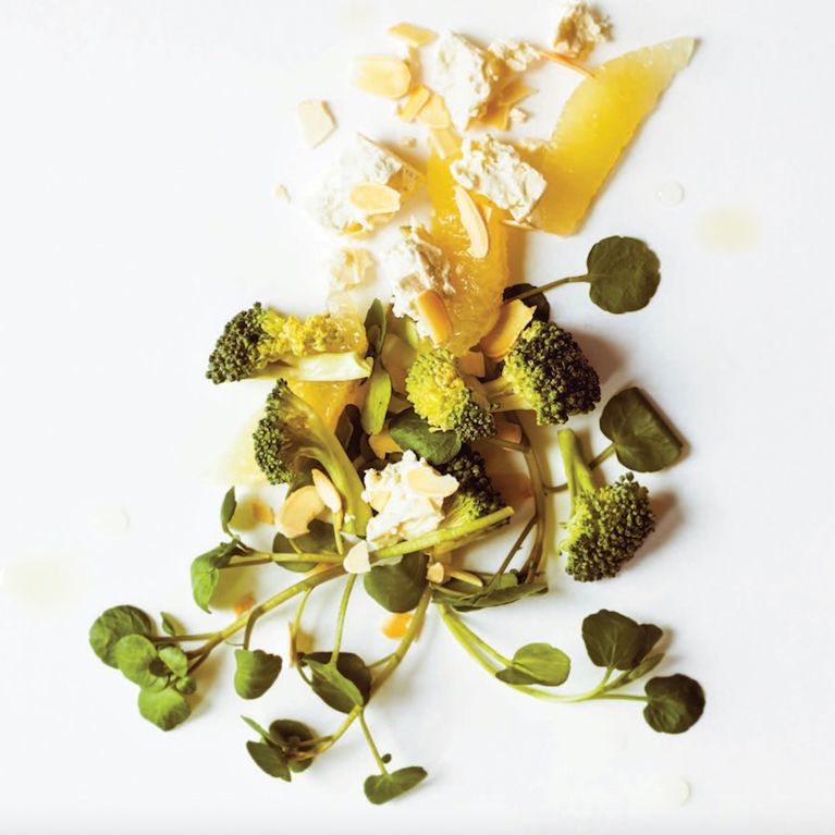 broccoli almonds grapefruit and watercress on white background