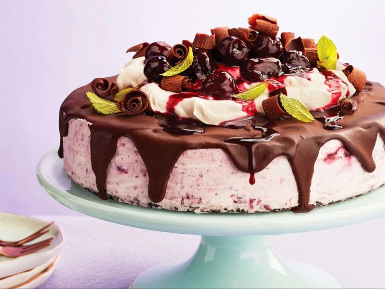 Black forest frozen cheesecake on a aqua cake holder 