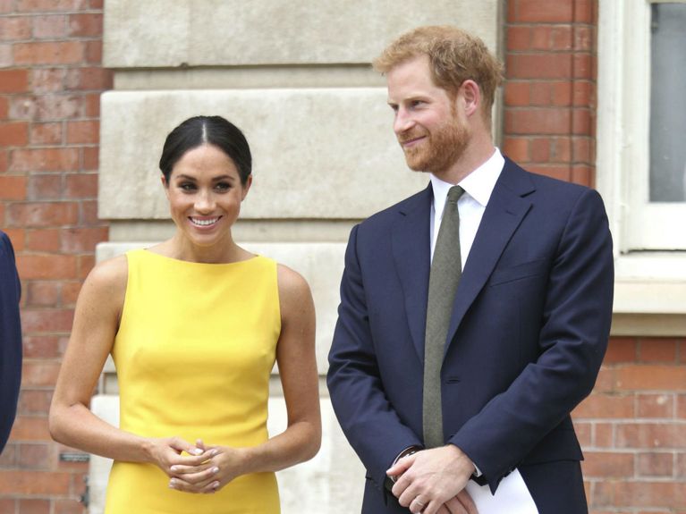 Meghan Markle Stuns In Sunny Yellow Sleeveless Dress