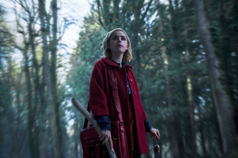 Netflix Chilling Adventures Of Sabrina- production still of group of witches at a bonfire