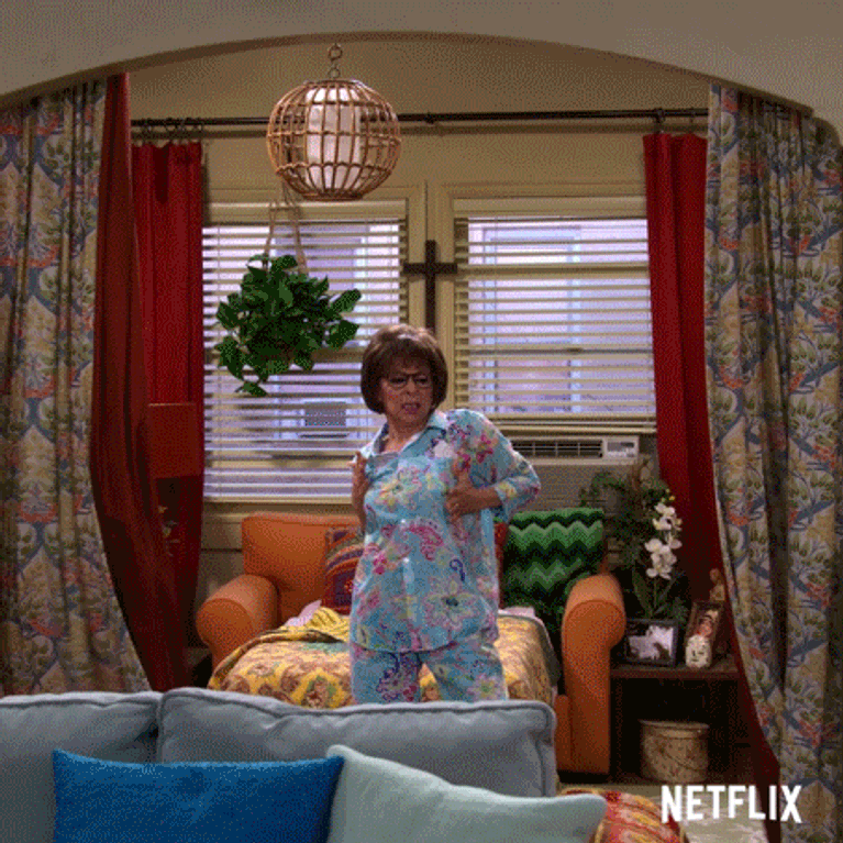Lydia Riera dances through a room in blue paisley pajamas in best netflix sitcom one day at a time