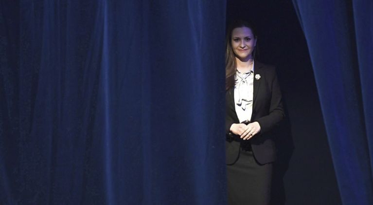 Canada anti-abortion movement-Tana Granic Allen stands behind a navy curtain