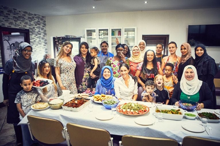 Meghan Markle with the community of women she's been working with for the cookbook