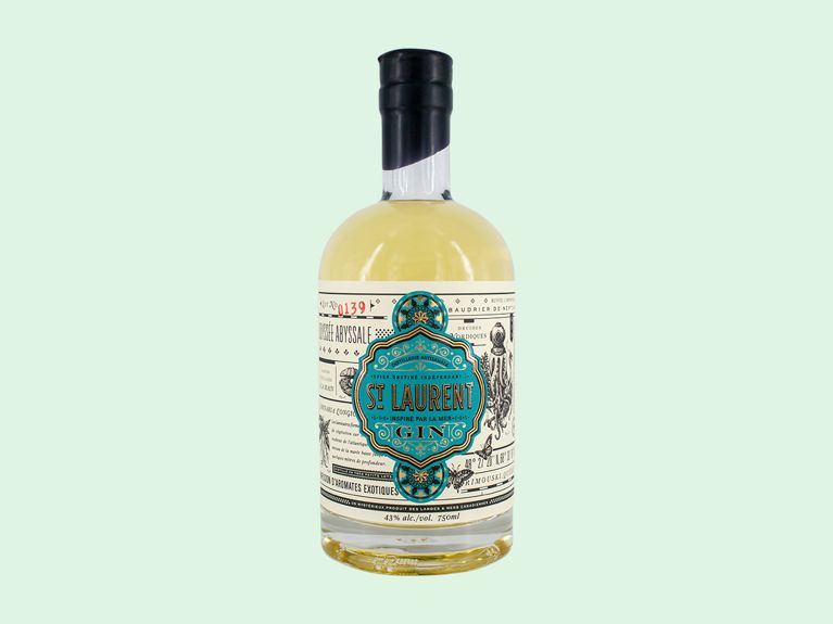 Kelp and Seaweed infused gins: St Laurent gin bottle on green background