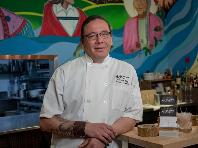 Ku-kum Kitchen's Chef Joseph seated in his restaurant