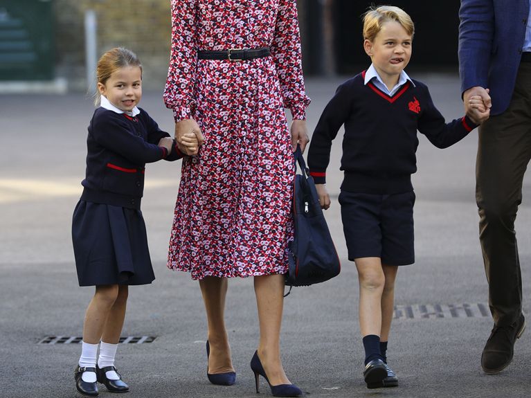 Princess Charlotte skips along to school as she holds her mother's hand