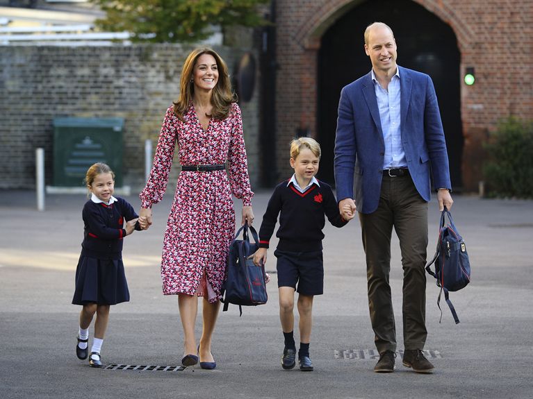 Princess Charlotte walks with her mother, brother and father holding hands on the way to school