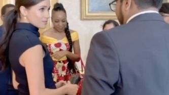 Meghan Markle Is Chic In Navy Dress At Buckingham Palace