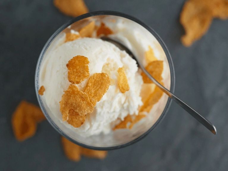 a scoop of cereal ice cream on a marble countertop