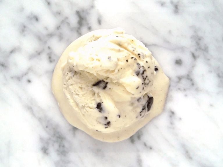 a scoop of mint chocolate ice cream on a marble countertop