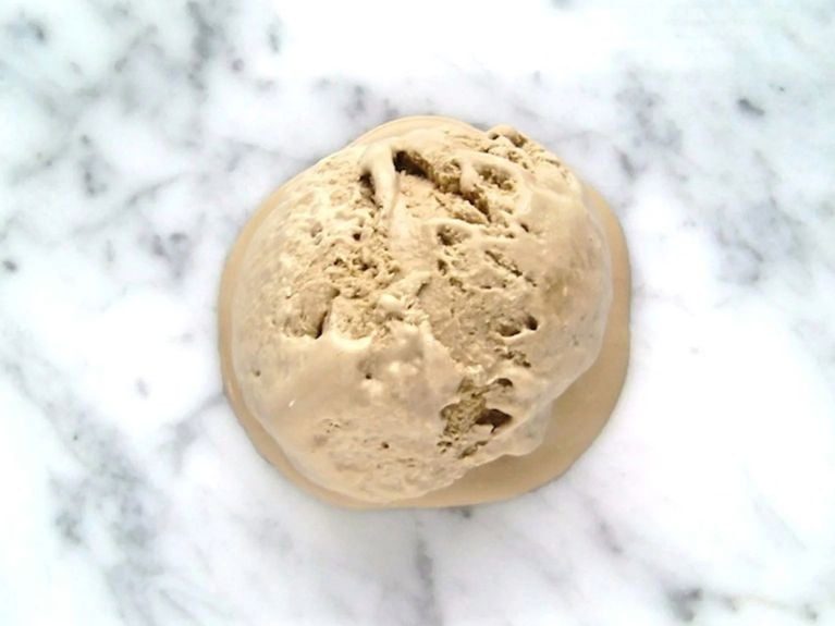 a scoop of stout ice cream on a marble counter top