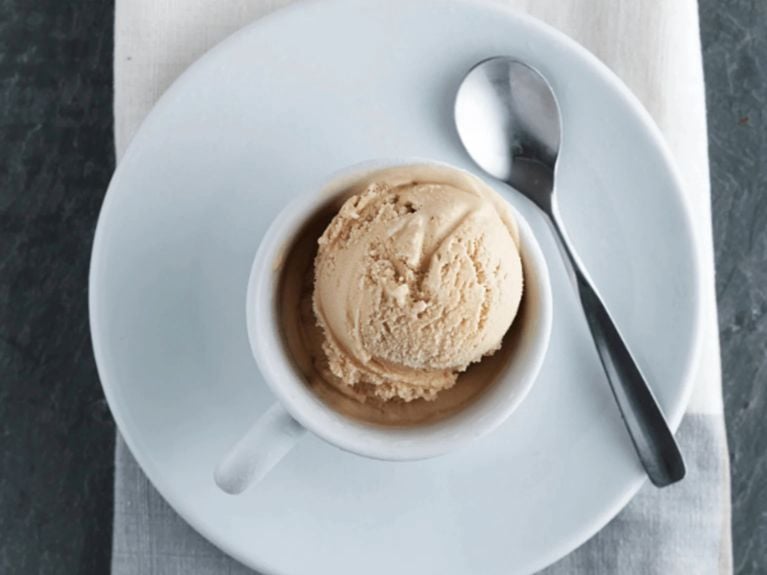 a scoop of Vietnamese coffee ice cream on a marble countertop 
