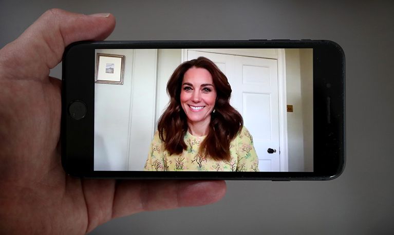 Kate Middleton wears a yellow dress in a video call