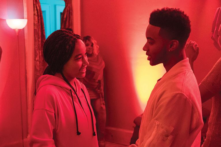 A photo of Amandla Stenberg and Algee Smith in The Hate U Give. 
