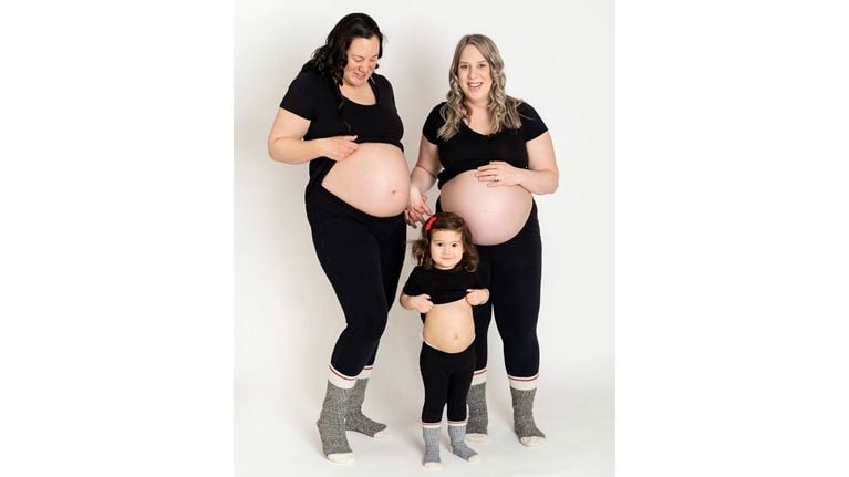 Natasha (left) with her wife, Cara, and their daughter, Alyssa.