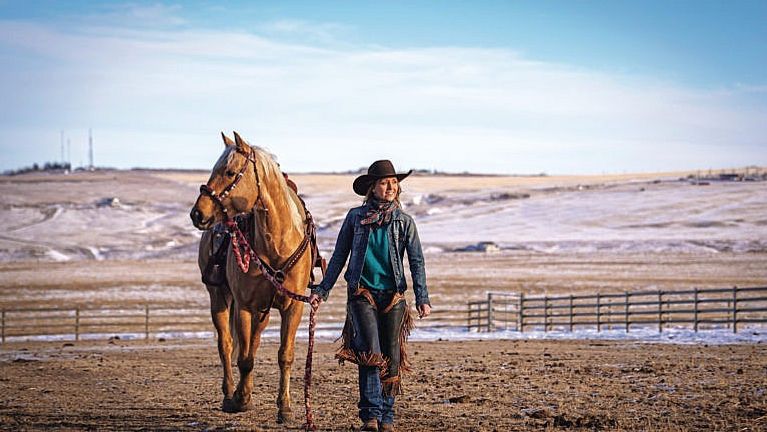 Canadian actor Amber Marshall and her horse Cruz, a palomino quarter house at her place near Calgary, Alberta on January 30, 2021. (Photograph by Leah Hennel)