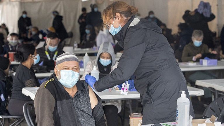 Man gets vaccinated at pop-up clinic