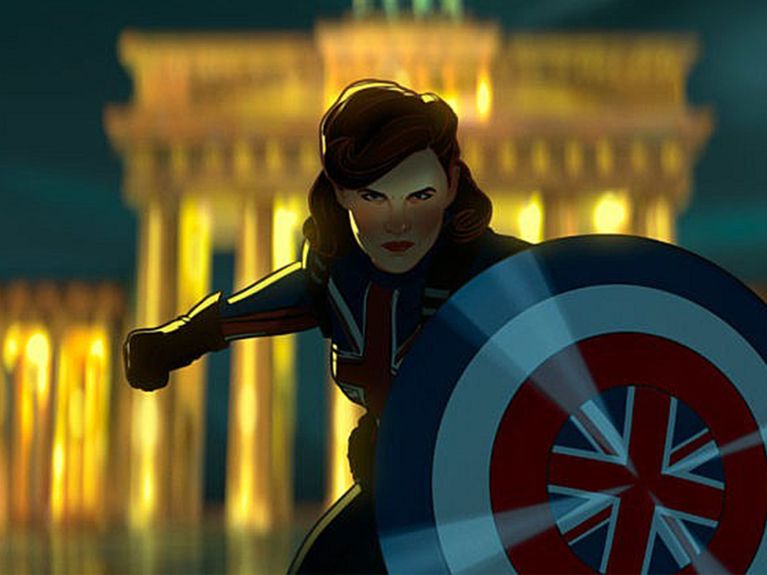Peggy Carter as Captain Carter holding a shield with the union jack