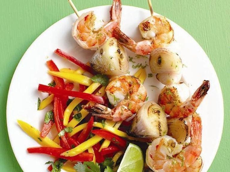 shrimp skewers with veggies on a white plate
