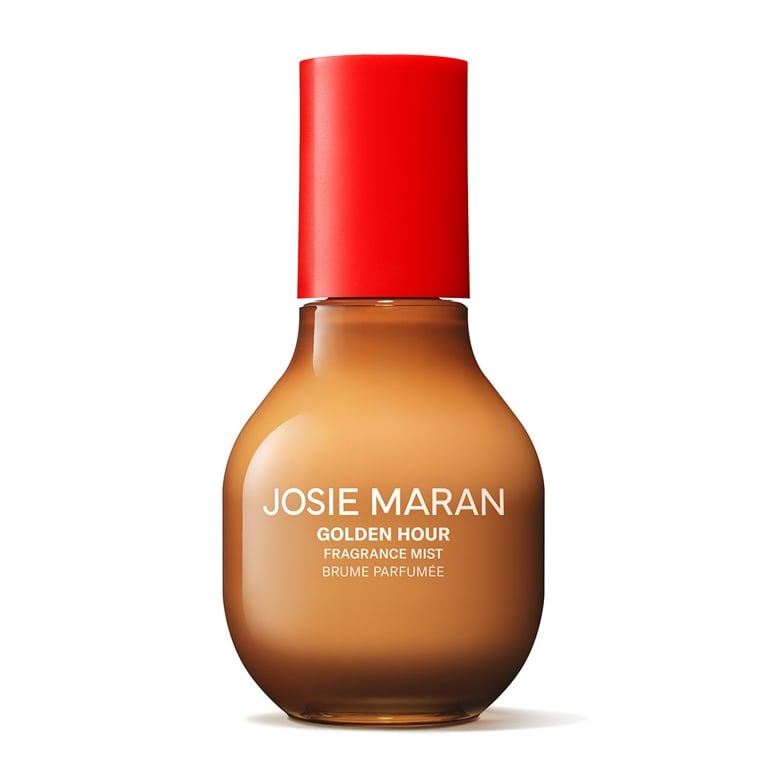 A bottle of Josie Maran Fragrance Mist in Golden Hour for an article about the best body mists to shop for summer.