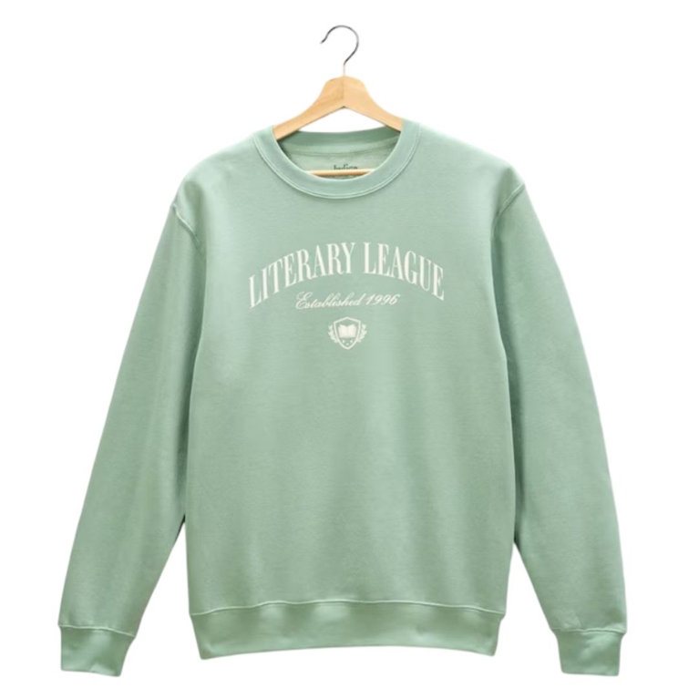 A Literary League pullover sweater in light green, for a post about the best gifts for book lovers.