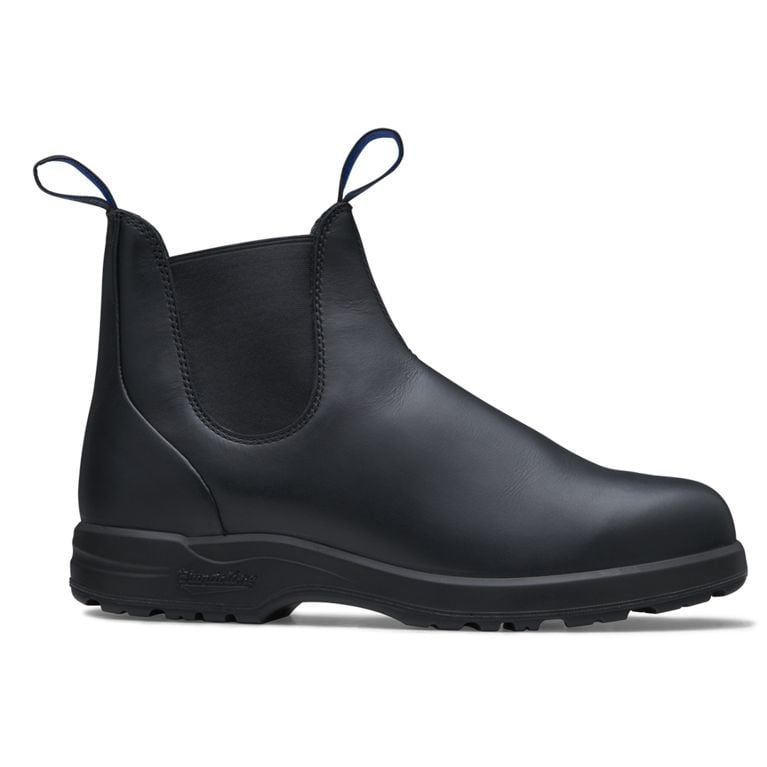 A pair of black thermal all-terrain Blundstone warm winter boots seen from the side for an article about warm stylish winter boots.