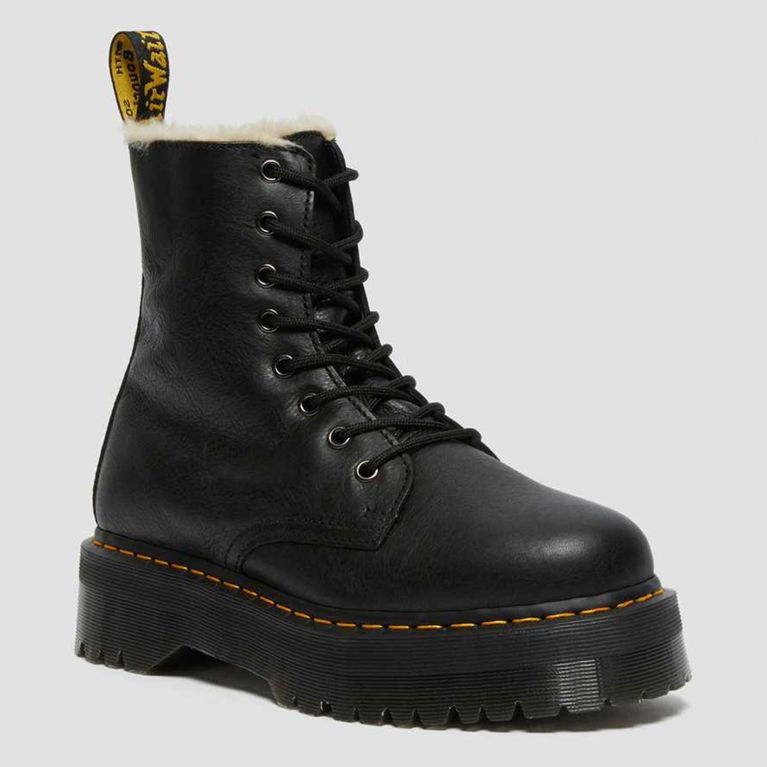 A pair of black Dr. Martens shearling-lined Jadon warm winter boots seen from the side for an article about warm stylish winter boots.