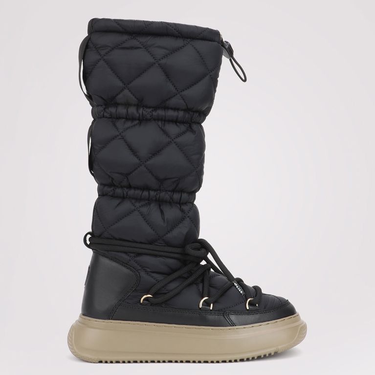 A pair of black Pajar Gravita Pull-On warm winter boots seen from the side for an article about warm stylish winter boots.