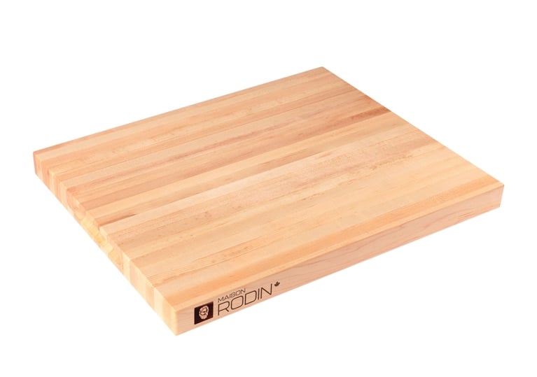 Edge-grain maple cutting board by Maison Rodin against a white background