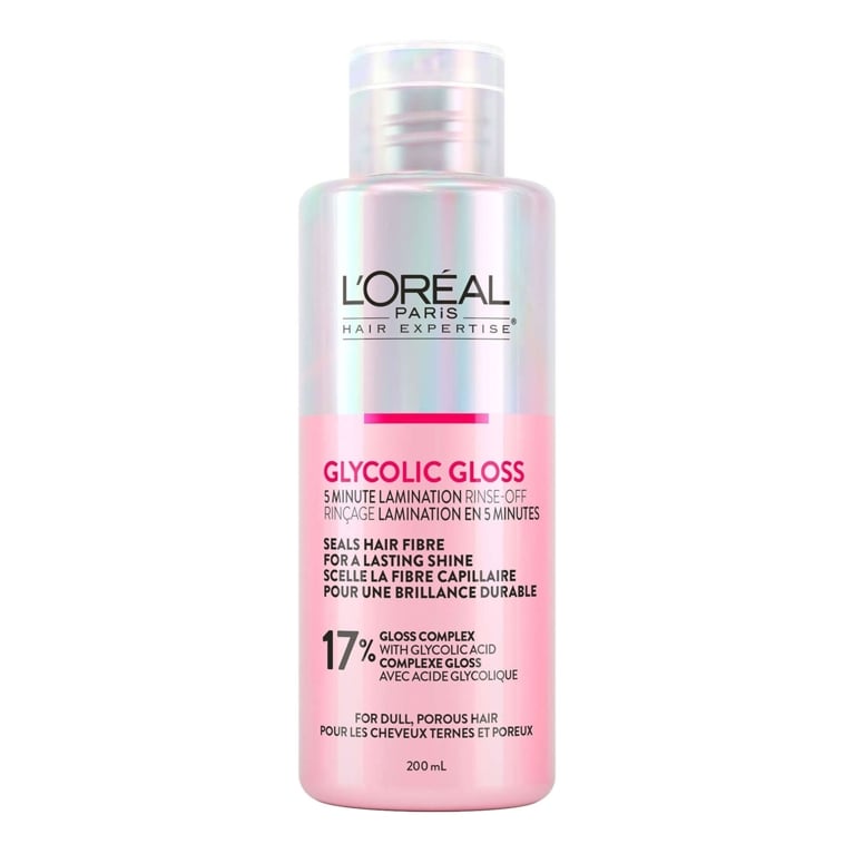 A pink and silver bottle of L'Oréal Paris Glycolic Gloss 5-Minute Lamination Rinse-Off on white background for an article about the best hair gloss treatments.