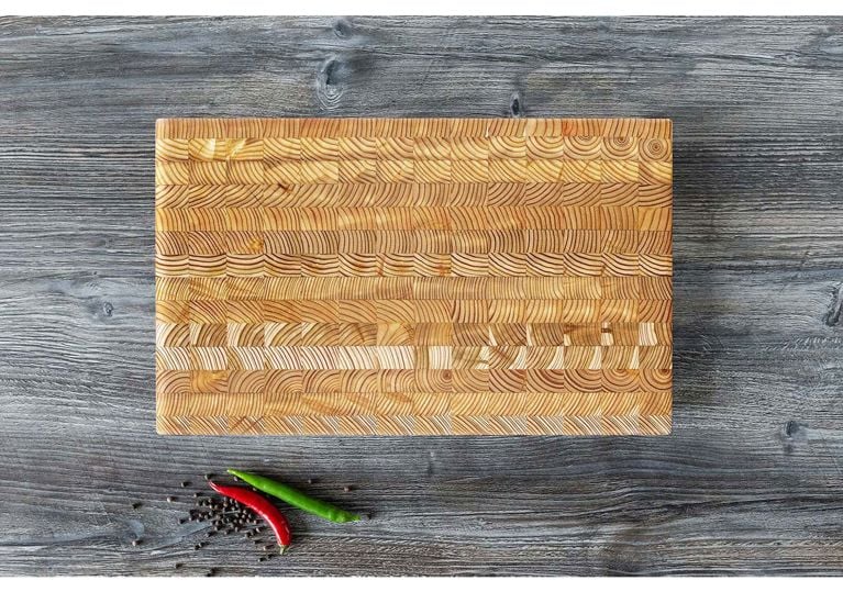 End-grain cutting board with intricate pattern by Larch Wood Canada
