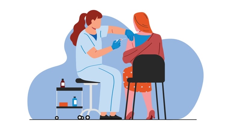 A woman in scrubs prepares to inject a patient's shoulder with MMR vaccine.
