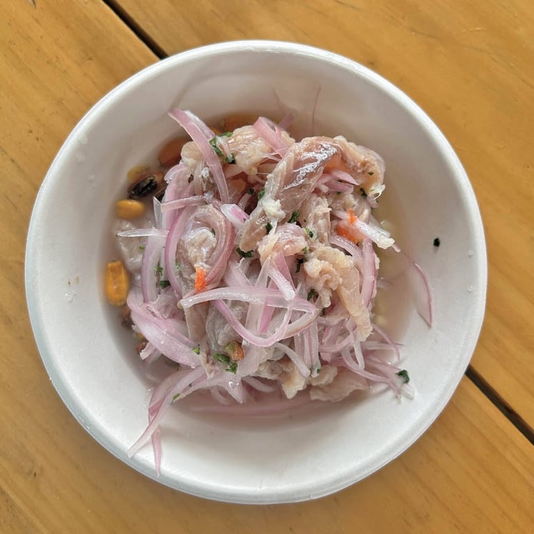 A bowl of ceviche in a post about lima peru