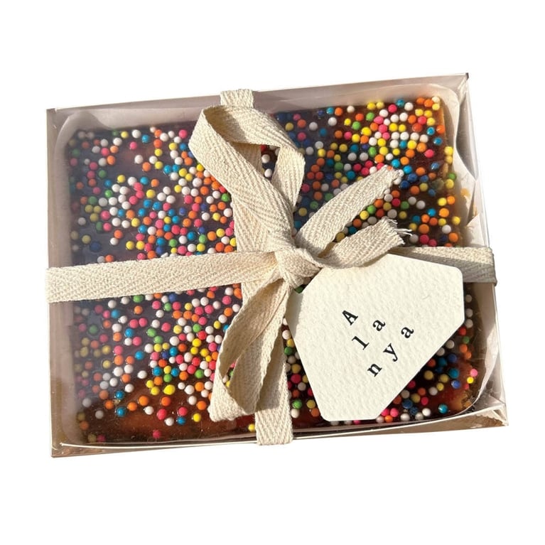 A box containing a sprinkles-covered chocolate treat in a post about lima peru