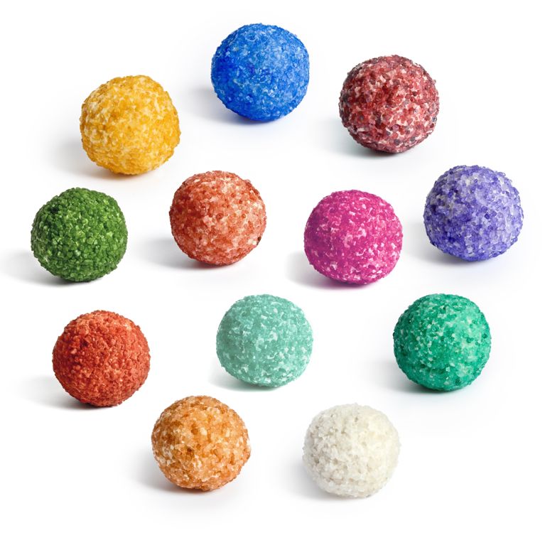Quai des bulles bath bonbons in an array of colours on a white background