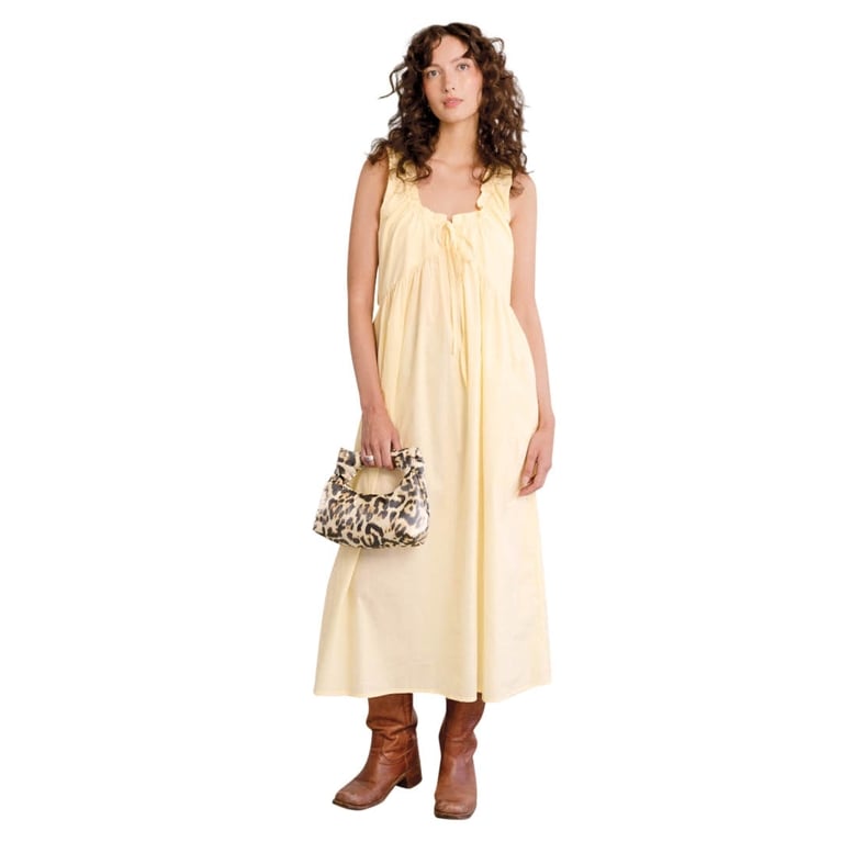 A butter yellow dress from A Bronze Age for an article about how to wear the butter yellow fashion trend.