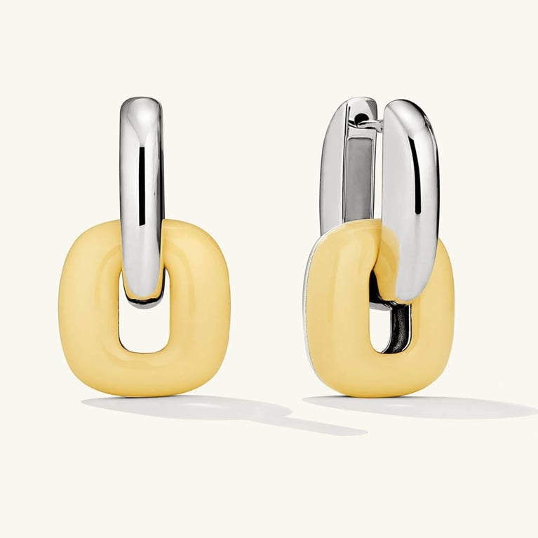 A pair of butter yellow Mejuri earrings for an article about how to wear the butter yellow fashion trend.