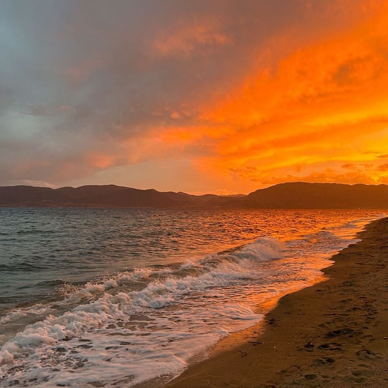A photo of a sunset in Greece on the beach for a review of the Club Med Gregolimano resort in Greece.
